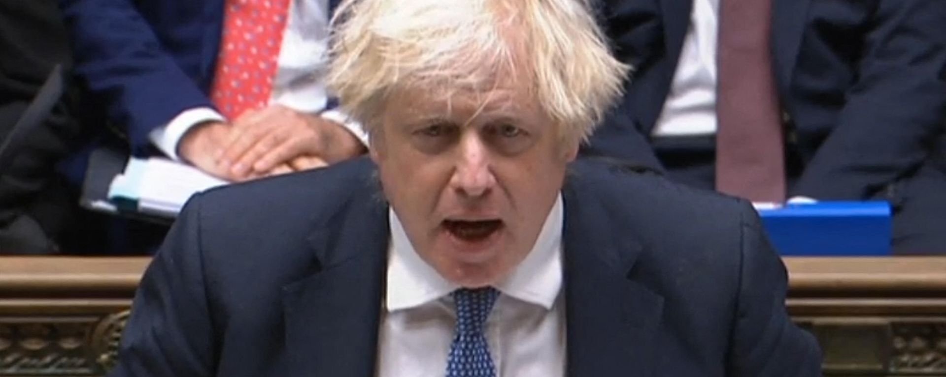 A video grab from footage broadcast by the UK Parliament's Parliamentary Recording Unit (PRU) shows British Prime Minister Boris Johnson speaking during Prime Minister's Questions (PMQs), in the House of Commons in London on December 8, 2021. A video grab from footage broadcast by the UK Parliament's Parliamentary Recording Unit (PRU) shows British Prime Minister Boris Johnson speaking during Prime Minister's Questions (PMQs), in the House of Commons in London on December 8, 2021. - Sputnik International, 1920, 08.12.2021