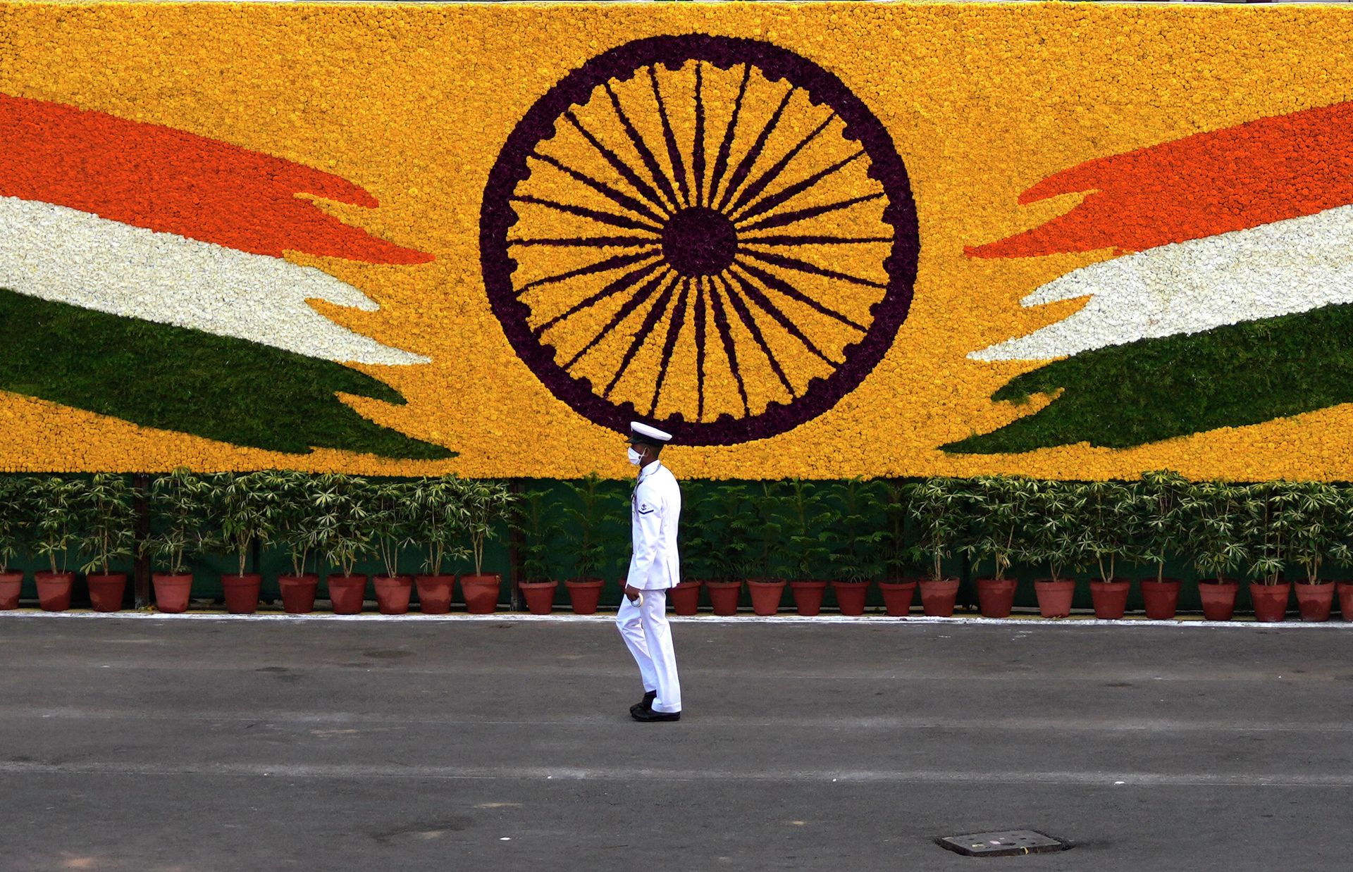 An Indian navy sailor walks past the national flag emblem during Independence Day celebrations at the historic 17th century Red Fort in New Delhi, India, Sunday, Aug. 15, 2021 An Indian navy sailor walks past the national flag emblem during Independence Day celebrations at the historic 17th century Red Fort in New Delhi, India, Sunday, Aug. 15, 2021 - Sputnik International, 1920, 22.04.2022