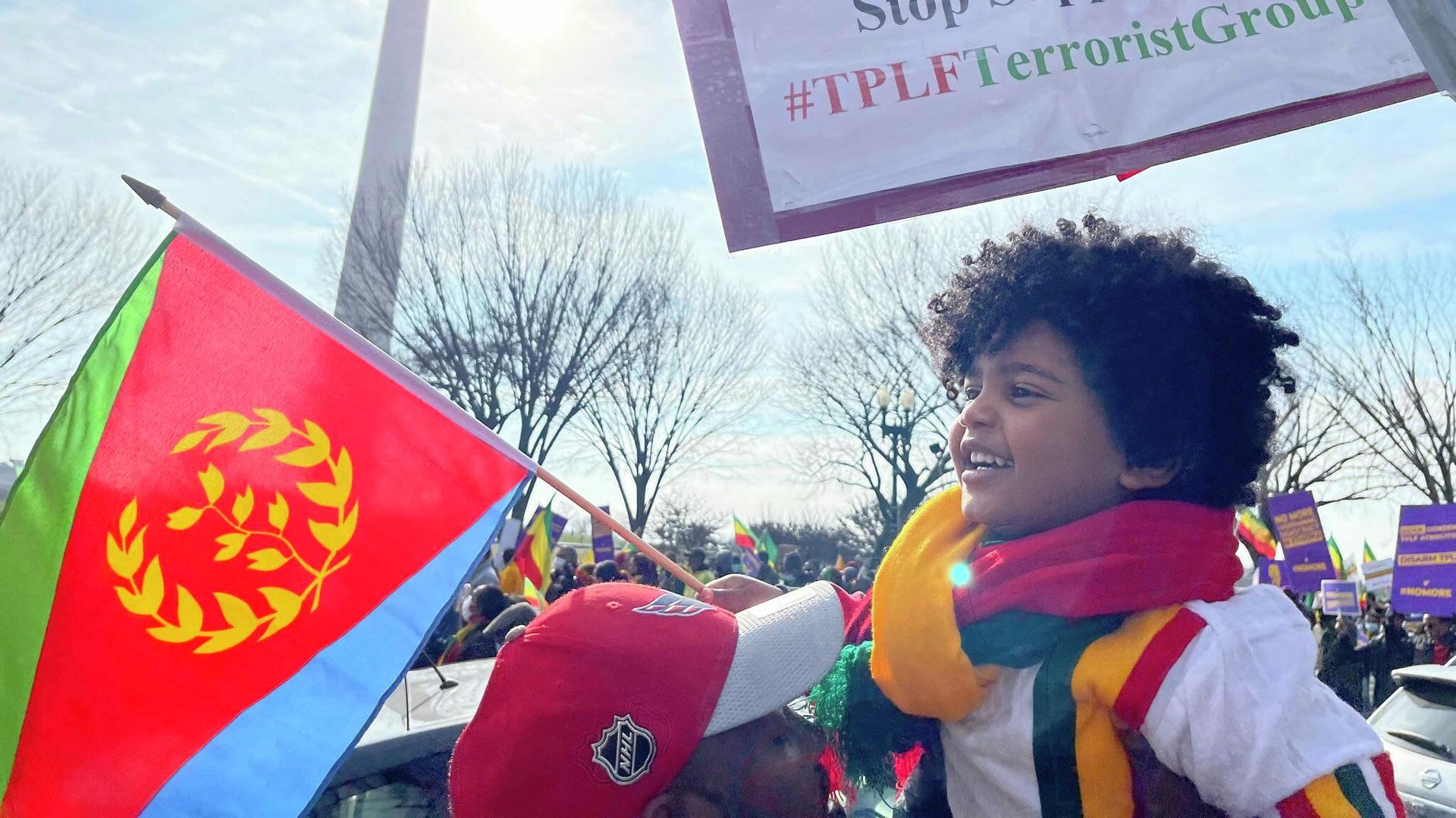 A boy holds an Eritrean flag in front of the Washington Monument during a #NoMore rally in Washington, DC, on December 10, 2021. Ethiopians and Eritreans have rallied for weeks against US intervention in their struggle against the Tigrayan People's Liberation Front (TPLF) rebel group. A boy holds an Eritrean flag in front of the Washington Monument during a #NoMore rally in Washington, DC, on December 10, 2021. Ethiopians and Eritreans have rallied for weeks against US intervention in their struggle against the Tigrayan People's Liberation Front (TPLF) rebel group. - Sputnik International, 1920, 10.12.2021