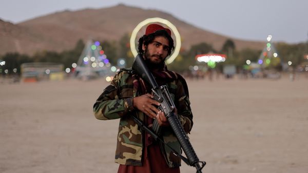 Taliban fighter, Mostashhed from Wardak province, looks on as he visits Kabul for the first time as hundreds of Taliban fighters take a day off to visit the amusement park at Kabul's Qargha reservoir, at the outskirts of Kabul, Afghanistan October 8, 2021. Picture taken October 8, 2021 - Sputnik International