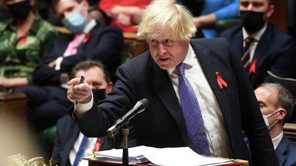 A handout photograph released by the UK Parliament shows Britain's Prime Minister Boris Johnson gesturing as he speaks during Prime Minister's Questions (PMQs) in the House of Commons in London on December 1, 2021 A handout photograph released by the UK Parliament shows Britain's Prime Minister Boris Johnson gesturing as he speaks during Prime Minister's Questions (PMQs) in the House of Commons in London on December 1, 2021 - Sputnik International