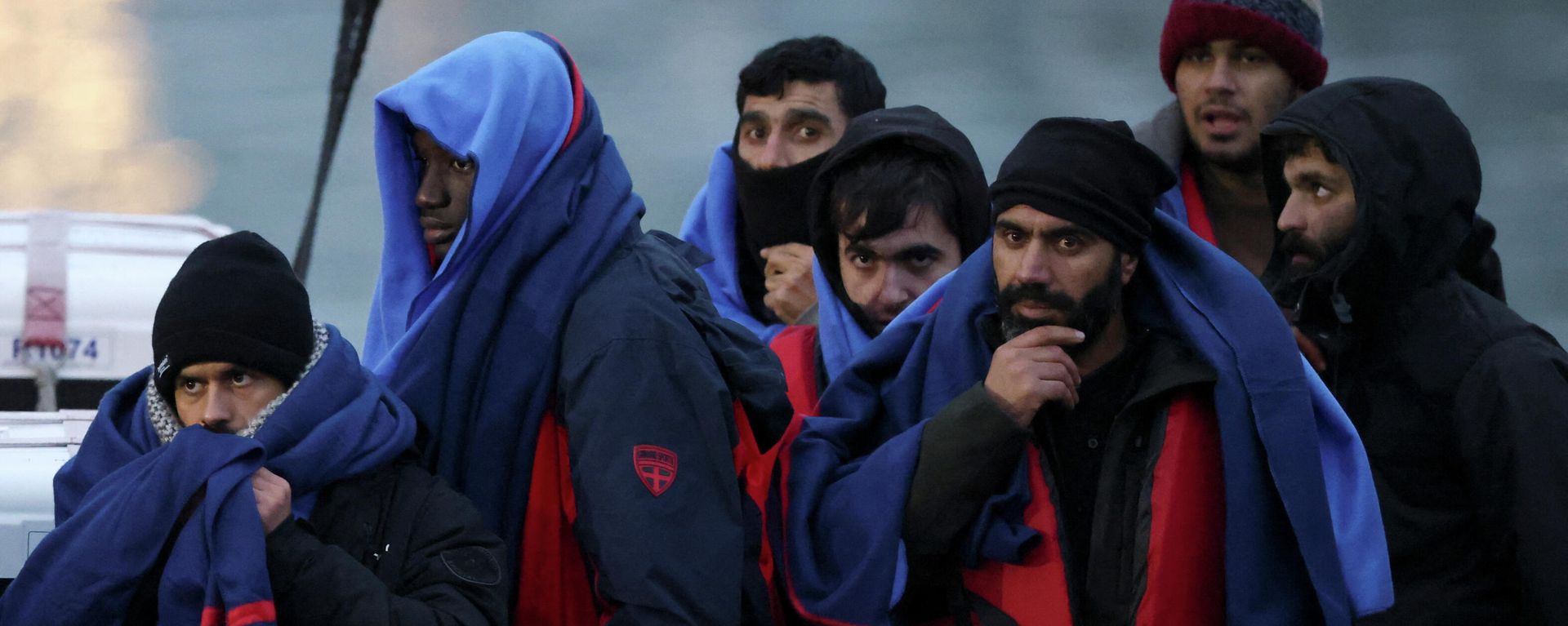 Migrants are brought ashore onboard a RNLI Lifeboat, after having crossed the channel, in Dover, Britain December 16, 2021 Migrants are brought ashore onboard a RNLI Lifeboat, after having crossed the channel, in Dover, Britain December 16, 2021 - Sputnik International, 1920, 16.12.2021