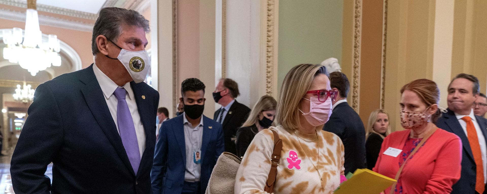Sen. Joe Manchin, D-W.Va., left, walks with Sen. Kyrsten Sinema, D-Ariz., after attending a Democratic policy luncheon, Tuesday, Nov. 16, 2021, on Capitol Hill in Washington. Sen. Joe Manchin, D-W.Va., left, walks with Sen. Kyrsten Sinema, D-Ariz., after attending a Democratic policy luncheon, Tuesday, Nov. 16, 2021, on Capitol Hill in Washington. - Sputnik International, 1920, 16.12.2021