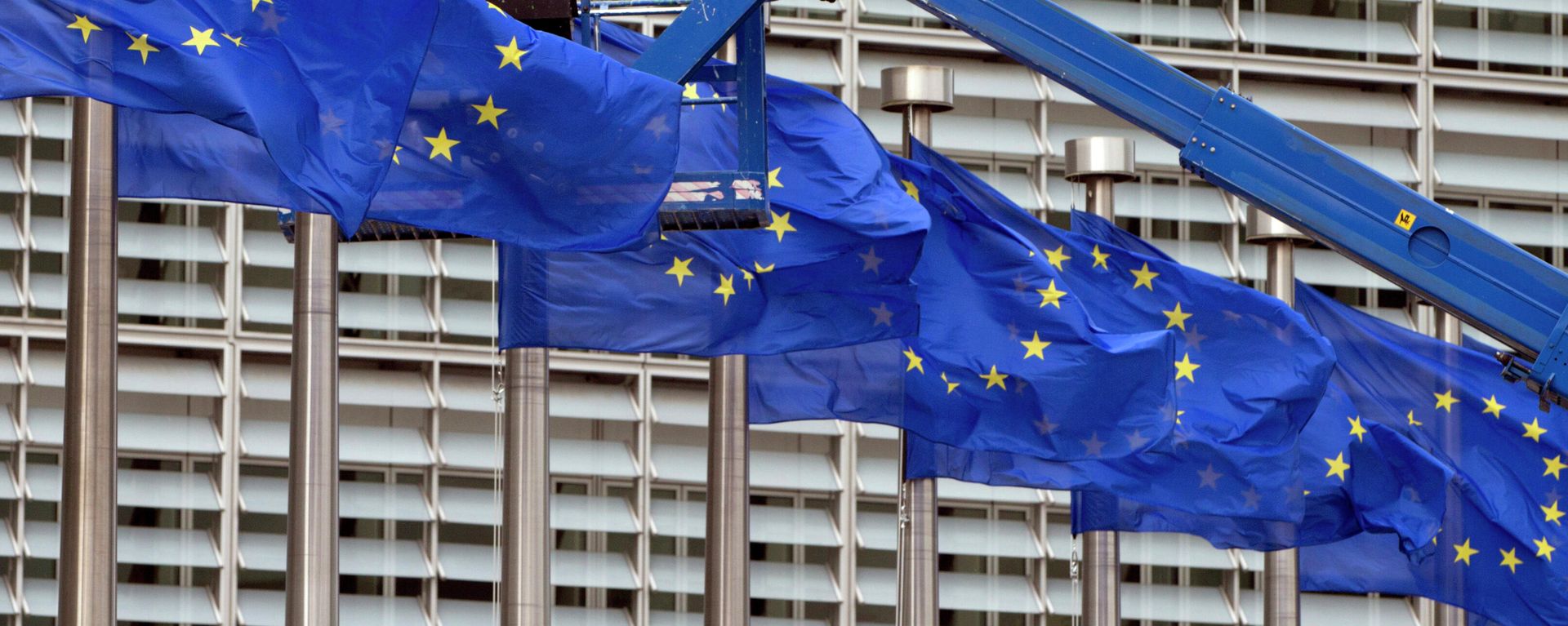 In this June 23, 2016 file photo, a worker on a lift adjusts the EU flags in front of EU headquarters in Brussels. - Sputnik International, 1920, 02.06.2022