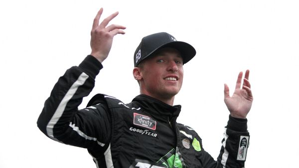 Brandon Brown, driver of the #68 TradeTheChain.com Chevrolet, waves to fans during pre-race ceremonies prior to the NASCAR Xfinity Series Kansas Lottery 300 at Kansas Speedway on October 23, 2021 - Sputnik International