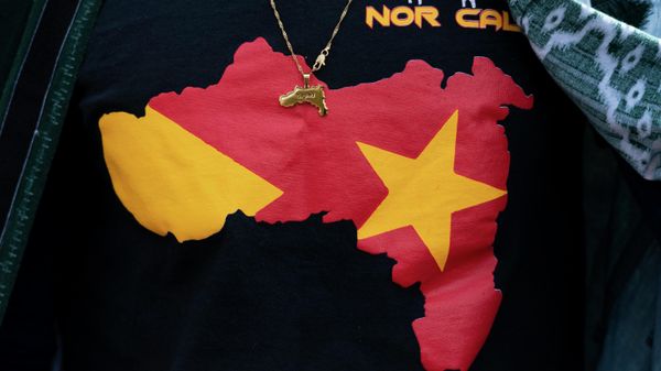 Angesom Mezgebo, wears a T shirt and a pendent, with images of map of Tigray during a protest march to mark a year since Ethiopia Prime Minister Abiy Ahmed's administration started fighting against the Tigray, the northernmost region in Ethiopia,Thursday, Nov. 4, 2021 in Washington. - Sputnik International