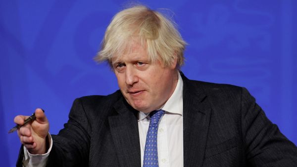 Britain's Prime Minister Boris Johnson attends a news conference to update the nation on the Covid-19 booster vaccine program in the Downing Street briefing room in central London, Britain, December 15, 2021.  - Sputnik International