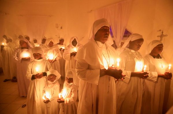 Christian faithful of the Legio Maria African Mission church attend the Christmas eve vigil mass amid the coronavirus disease (COVID-19) pandemic at their church in the Fort Jesus area of Nairobi, Kenya, 25 December 2021. Christian faithful of the Legio Maria African Mission church attend the Christmas eve vigil mass amid the coronavirus disease (COVID-19) pandemic at their church in the Fort Jesus area of Nairobi, Kenya, 25 December 2021. - Sputnik International