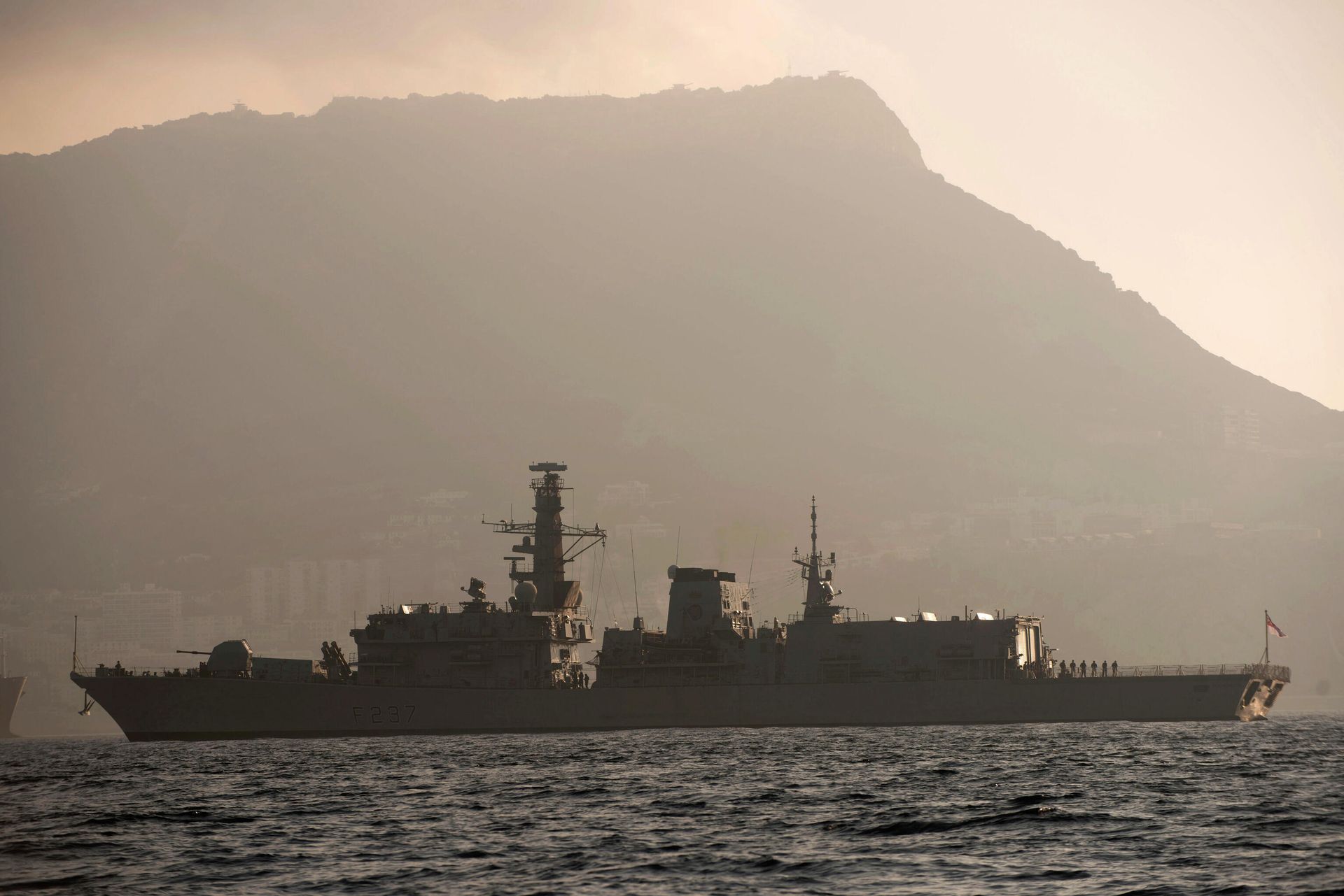 With the rock of Gibraltar in the background, Britain's Royal Navy ship HMS Westminster sails along the Gibraltar stretch near to La Linea de la Concepcion, Spain, Monday, Aug. 19, 2013. The British government said it is considering taking Spain to court if it does not ease border checks on traffic entering the disputed enclave of Gibraltar. Spain has long laid claim to Gibraltar, and the tiny territory on the southern tip of the Iberian peninsula is the source of occasional diplomatic friction between Madrid and London. The latest spat involved an artificial reef being built in Gibraltar that Spain said is hurting its fishermen. It also floated the idea of charging people entering and leaving Gibraltar 50 euros ($66) to provide compensation for the losses that the fishermen face. With the rock of Gibraltar in the background, Britain's Royal Navy ship HMS Westminster sails along the Gibraltar stretch near to La Linea de la Concepcion, Spain, Monday, Aug. 19, 2013. The British government said it is considering taking Spain to court if it does not ease border checks on traffic entering the disputed enclave of Gibraltar. Spain has long laid claim to Gibraltar, and the tiny territory on the southern tip of the Iberian peninsula is the source of occasional diplomatic friction between Madrid and London. The latest spat involved an artificial reef being built in Gibraltar that Spain said is hurting its fishermen. It also floated the idea of charging people entering and leaving Gibraltar 50 euros ($66) to provide compensation for the losses that the fishermen face. - Sputnik International, 1920, 26.12.2021