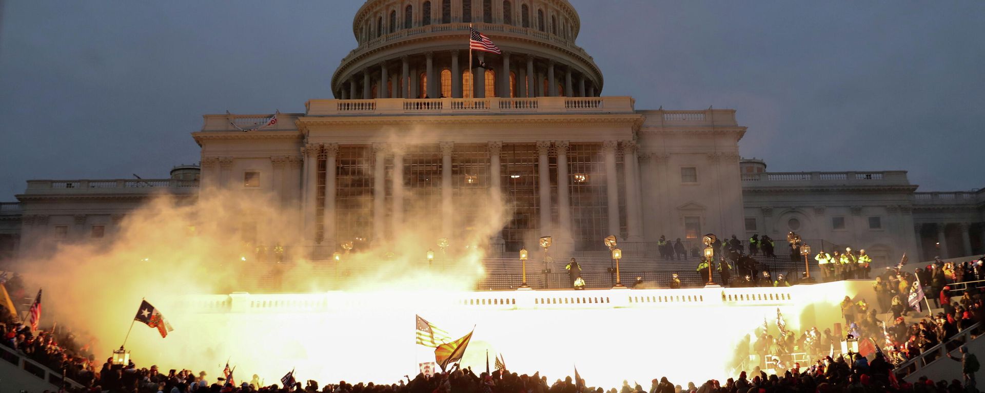 An explosion caused by a police munition is seen while supporters of U.S. President Donald Trump riot in front of the U.S. Capitol Building in Washington, U.S., January 6, 2021. An explosion caused by a police munition is seen while supporters of U.S. President Donald Trump riot in front of the U.S. Capitol Building in Washington, U.S., January 6, 2021. - Sputnik International, 1920, 05.01.2022