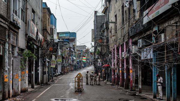 Indian Home Guard personnel stand in an empty street of Sadar Bazar wholesale market which is partially closed for violating COVID-19 guidelines in New Delhi, India, Tuesday, July 13, 2021. - Sputnik International