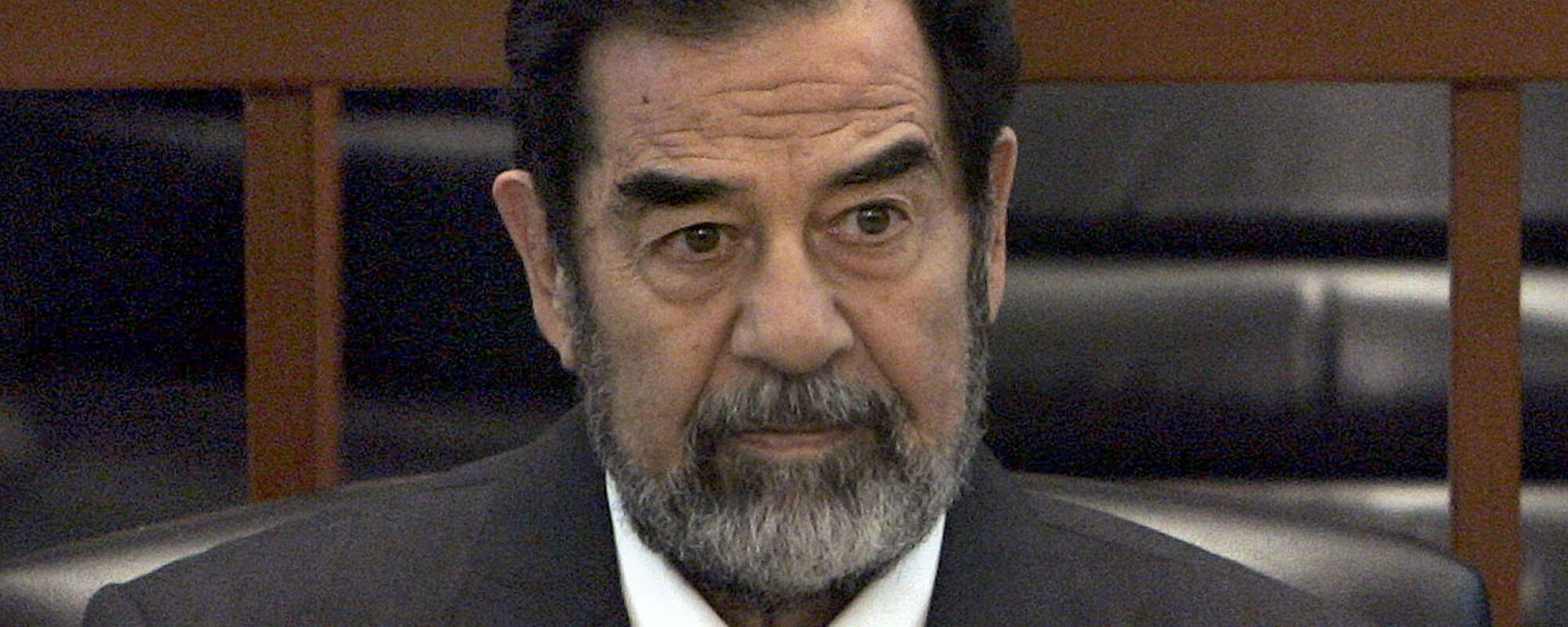 In this Dec. 6, 2006 file photo, former Iraq leader Saddam Hussein sits in court in Baghdad, Iraq, during the Anfal trial against him In this Dec. 6, 2006 file photo, former Iraq leader Saddam Hussein sits in court in Baghdad, Iraq, during the Anfal trial against him - Sputnik International, 1920, 30.12.2022