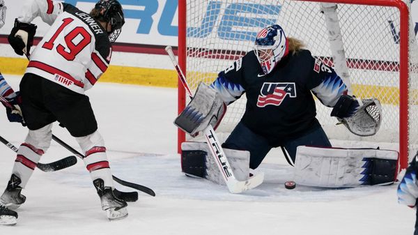 United States goalie Alex Cavallini, right, stops a shot from Canada's Brianne Jenner (19) during the second period of a women's exhibition hockey game ahead of the Beijing Olympics Wednesday, Dec. 15, 2021, in Maryland Heights, Mo. - Sputnik International