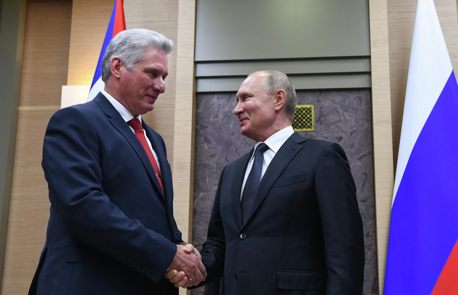 Russian President Vladimir Putin shakes hands with Cuban President Miguel Diaz-Canel during their meeting at Novo-Ogarevo residence, outside Moscow, Russia. Russian President Vladimir Putin shakes hands with Cuban President Miguel Diaz-Canel during their meeting at Novo-Ogarevo residence, outside Moscow, Russia. - Sputnik International, 1920, 03.01.2022