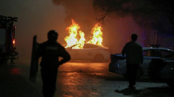 A view shows a burning police car during a protest against LPG cost rise following the Kazakh authorities' decision to lift price caps on liquefied petroleum gas in Almaty, Kazakhstan January 5, 2022. - Sputnik International