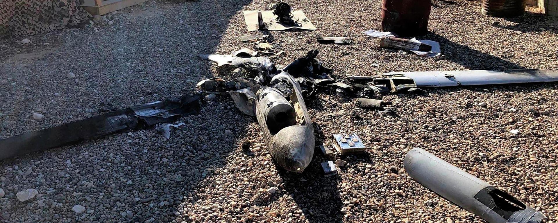Parts of the wreckage of a drone are laid out on the ground near the Ain al-Asad airbase, in the western Anbar province of Iraq, Tuesday, Jan. 4, 2022. Parts of the wreckage of a drone are laid out on the ground near the Ain al-Asad airbase, in the western Anbar province of Iraq, Tuesday, Jan. 4, 2022. - Sputnik International, 1920, 18.10.2023