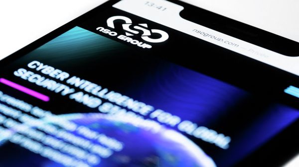 This studio photographic illustration shows a smartphone with the website of Israel's NSO Group which features 'Pegasus' spyware, on display in Paris on July 21, 2021. - Private Israeli firm NSO Group has denied media reports its Pegasus software is linked to the mass surveillance of journalists and rights defenders, and insisted that all sales of its technology are approved by Israel's defence ministry (Photo by JOEL SAGET / AFP) - Sputnik International
