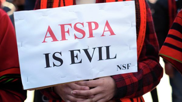A Naga holds a placard during a rally protesting the killings of fourteen civilians by Indian army soldiers earlier this month, in Kohima, capital of the northeastern Indian state of Nagaland, Friday, Dec. 17, 2021.  - Sputnik International