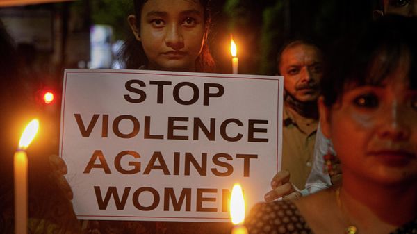 Indians hold placards protesting against the alleged gang rape and killing of a Dalit woman in Uttar Pradesh state, in Gauhati, India, Saturday, Oct. 10, 2020 - Sputnik International