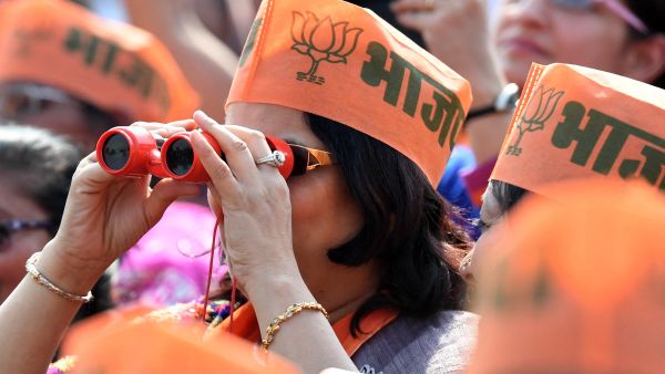 A supporter of Indian Prime Minister and Bharatiya Janata Party (BJP) Leader Narendra Modi uses binoculars (File) A supporter of Indian Prime Minister and Bharatiya Janata Party (BJP) Leader Narendra Modi uses binoculars (File) - Sputnik International