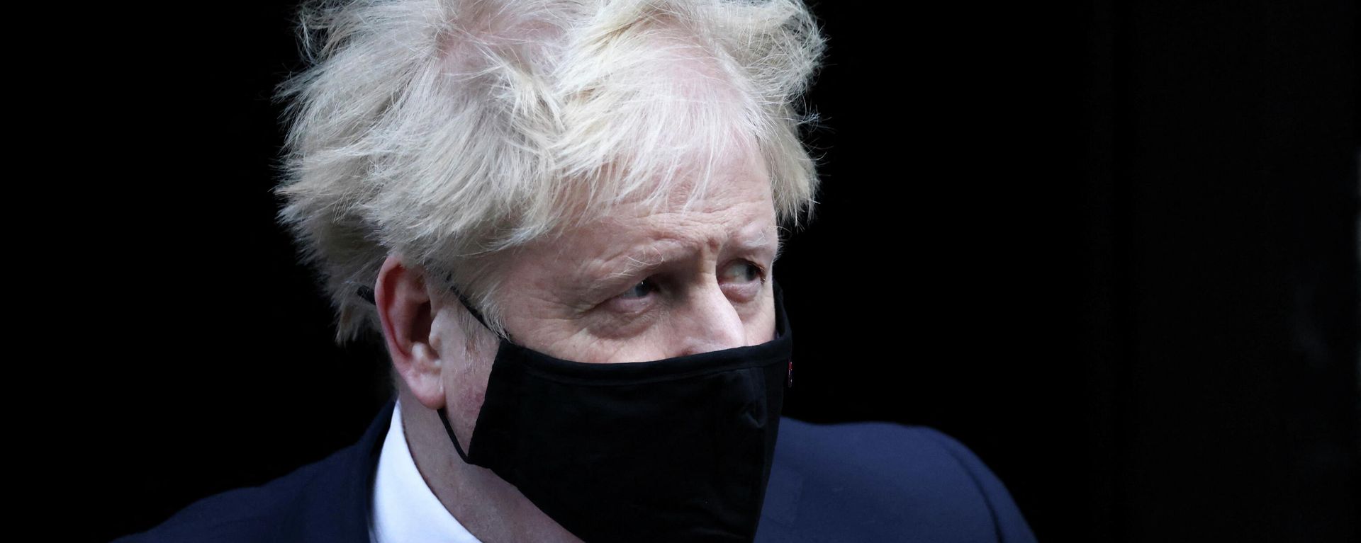British Prime Minister Boris Johnson walks outside Downing Street in London, Britain, January 12, 2022. British Prime Minister Boris Johnson walks outside Downing Street in London, Britain, January 12, 2022. - Sputnik International, 1920, 17.01.2022
