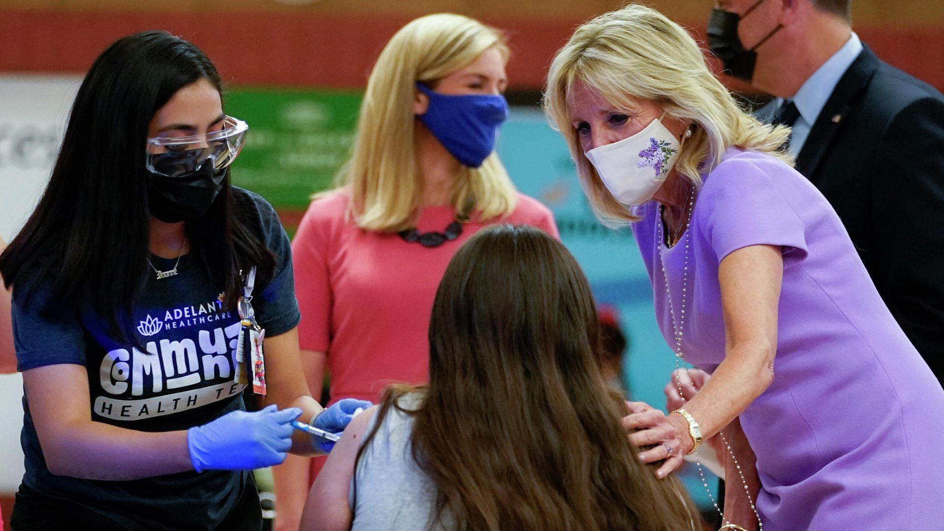 First lady Jill Biden comforts a person as they get a COVID-19 vaccination during a tour of the site at Isaac Middle School in Phoenix, Wednesday, June 30, 2021. First lady Jill Biden comforts a person as they get a COVID-19 vaccination during a tour of the site at Isaac Middle School in Phoenix, Wednesday, June 30, 2021. - Sputnik International, 1920, 14.01.2022