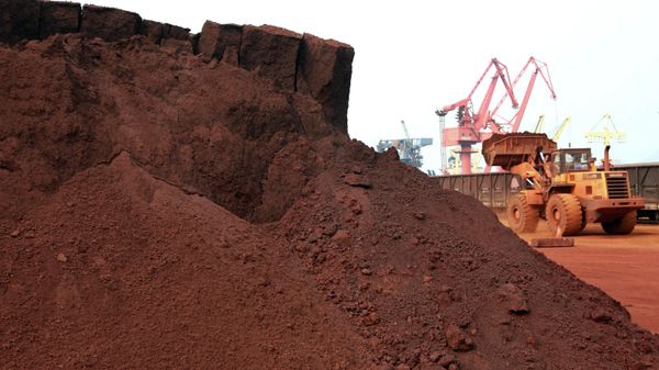 In a picture taken on September 5, 2010 a man driving a front loader shifts soil containing rare earth minerals to be loaded at a port in Lianyungang, east China's Jiangsu province, for export to Japan.  China's restrictions on exports of rare earths are aimed at maximising profit, strengthening its homegrown high-tech companies and forcing other nations to help sustain global supply, experts say. China last year produced 97 percent of the global supply of rare earths -- a group of 17 elements used in high-tech products ranging from flat-screen televisions to iPods to hybrid cars -- but is home to just a third of reserves.  CHINA OUT   AFP PHOTO (Photo by AFP) - Sputnik International