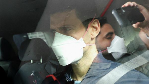 Serbian tennis player Novak Djokovic departs the Park Hotel while under immigration detention, to convene with his legal team after his visa to play in the Australian Open was cancelled a second time, in Melbourne, Australia, January 16, 2022. - Sputnik International