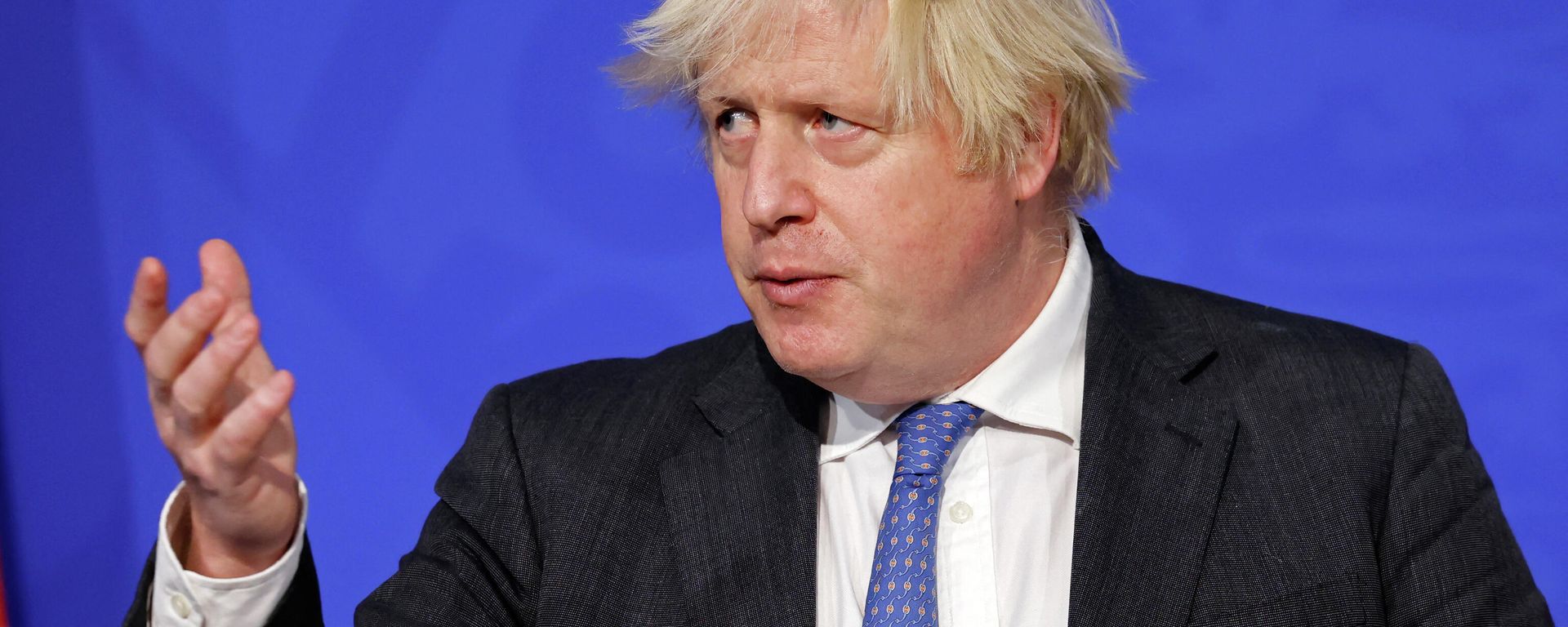 Britain's Prime Minister Boris Johnson speaks at a press conference to update the nation on the Covid-19 booster vaccine program in the Downing Street briefing room in central London on December 15, 2021 Britain's Prime Minister Boris Johnson speaks at a press conference to update the nation on the Covid-19 booster vaccine program in the Downing Street briefing room in central London on December 15, 2021 - Sputnik International, 1920, 16.01.2022