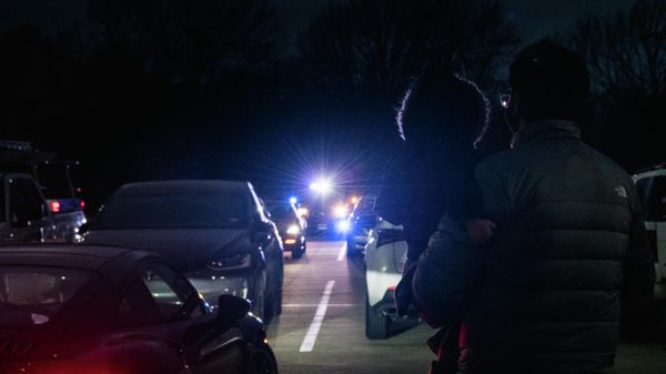 A father carries his child out of a Catholic Mass service near the Congregation Beth Israel synagogue on January 15, 2022 in Colleyville, Texas. Police responded to a hostage situation after reports of a man with a gun was holding people captive at the synagogue. - Sputnik International