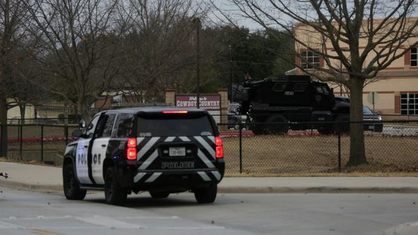 A law enforcement vehicle is seen in the area where a man has reportedly taken people hostage at a synagogue during services that were being streamed live, in Colleyville, Texas, U.S. January 15, 2022. REUTERS/Shelby Tauber - Sputnik International