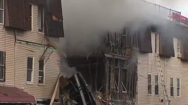 New York firefighters battle a blaze in The Bronx where a gas explosion killed one person and injured nine others on January 18, 2022. - Sputnik International