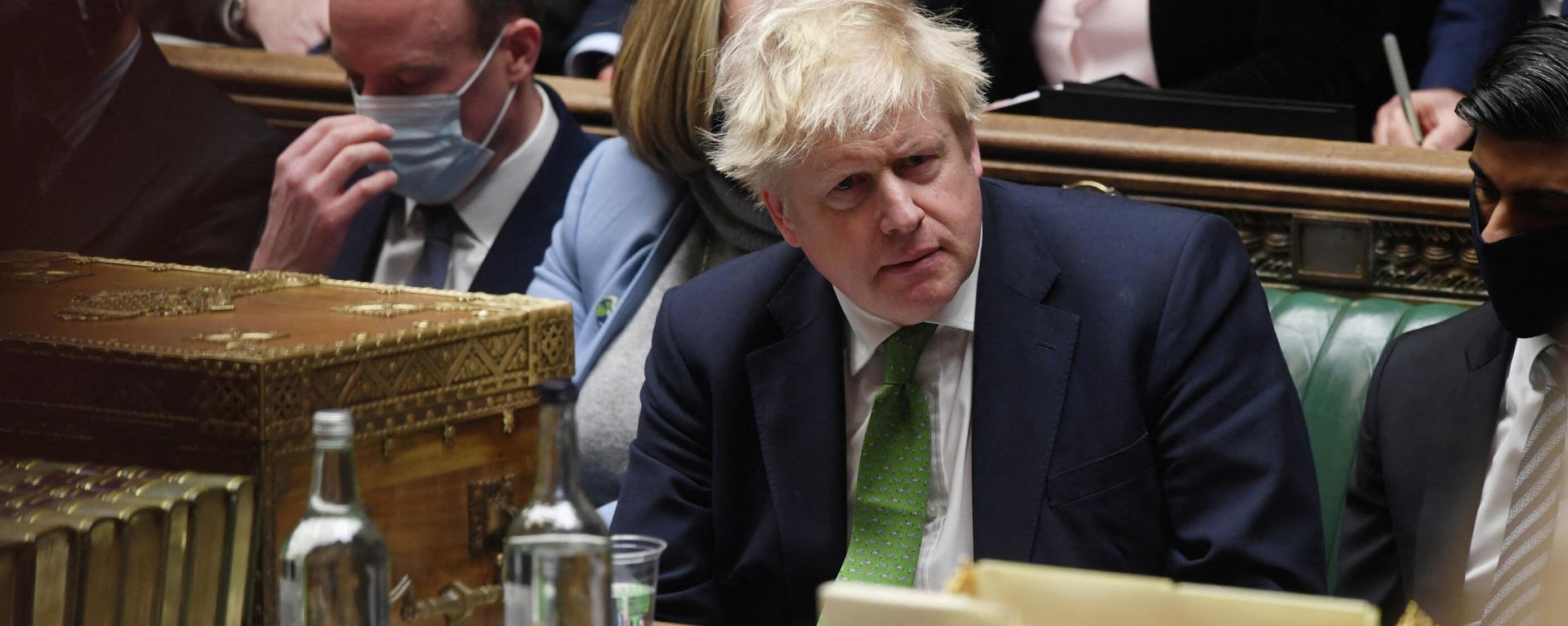 British Prime Minister Boris Johnson listens during the weekly question time debate at Parliament in London, Britain, January 19, 2022.  - Sputnik International, 1920, 20.01.2022