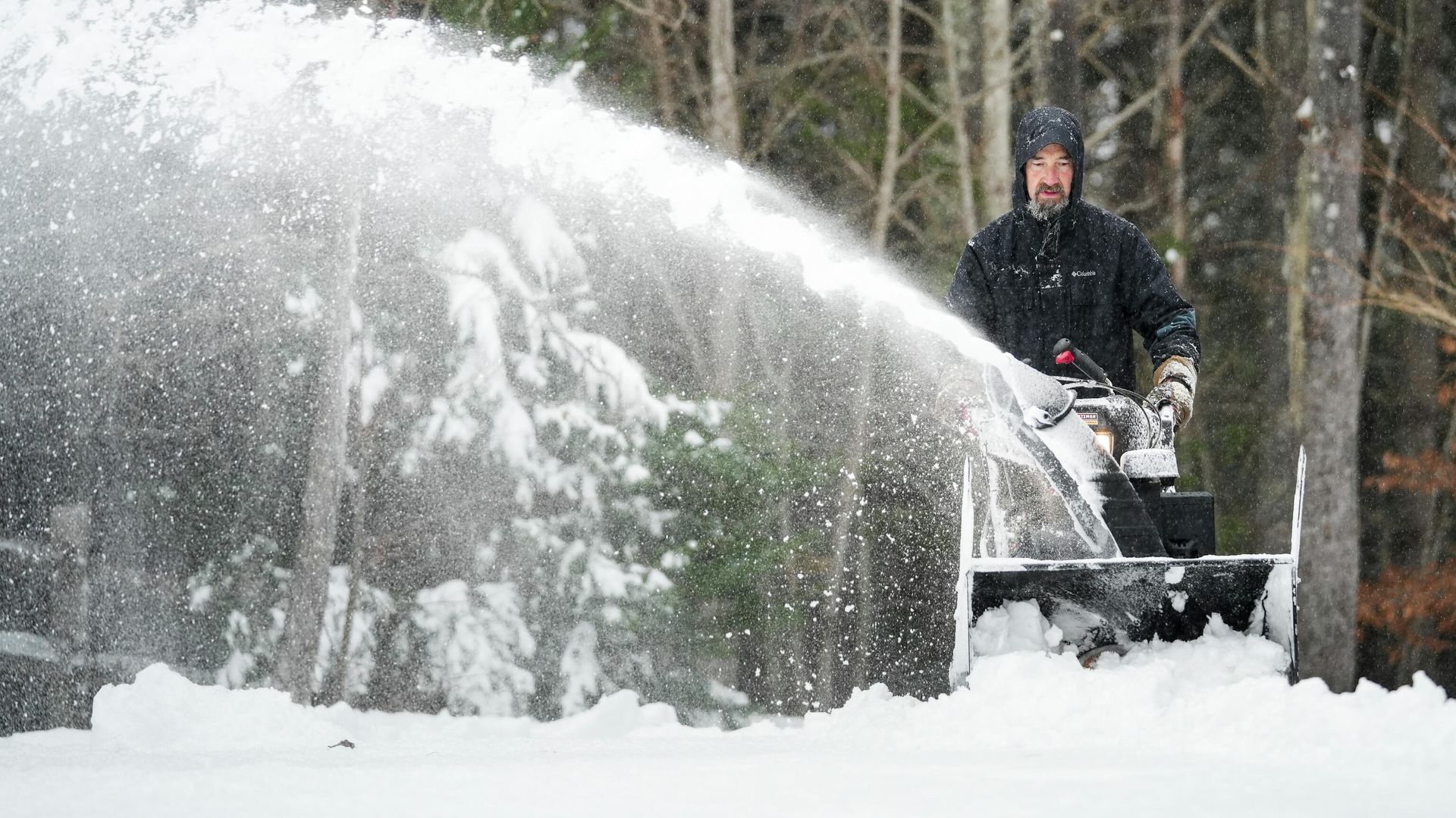 Jim Long uses his snow blower to clear a pile of snow from his driveway during a winter storm, Sunday, Jan. 16, 2022 in Morganton, N.C. A coat of ice underneath snow-covered roads made it hard to walk and clear driveways Jim Long uses his snow blower to clear a pile of snow from his driveway during a winter storm, Sunday, Jan. 16, 2022 in Morganton, N.C. A coat of ice underneath snow-covered roads made it hard to walk and clear driveways - Sputnik International, 1920, 23.01.2022