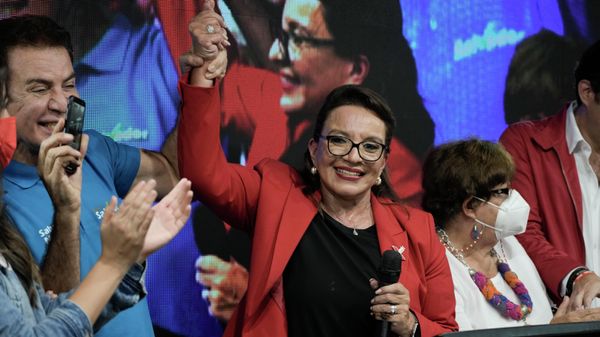Free Party presidential candidate Xiomara Castro has her hand raised by her running mate Salvador Nasralla after general elections, in Tegucigalpa, Honduras, Sunday, Nov. 28, 2021. Castro claimed victory, setting up a showdown with the National Party which said its candidate had won a vote that could end the conservative party's 12 years in power. - Sputnik International