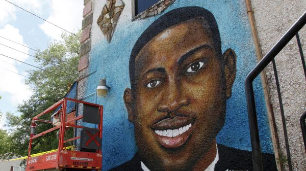 In this May 17, 2020, photo, a recently painted mural of Ahmaud Arbery is on display in Brunswick, Ga., where the 25-year-old man was shot and killed in February. It was painted by Miami artist Marvin Weeks. ( - Sputnik International