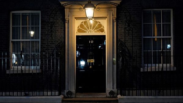 A light shines above the door of 10 Downing Street, the official residence of Britain's Prime Minister, in central London on January 31, 2022. - Sputnik International