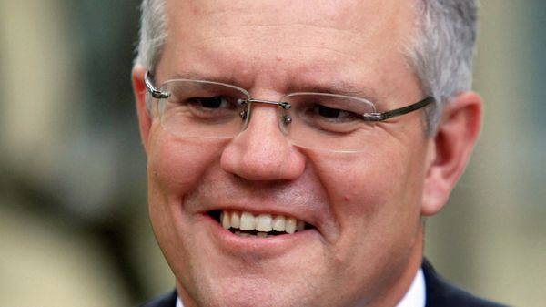 Australia's Immigration Minister Scott Morrison smiles during an interview with Reuters in Phnom Penh September 26, 2014. Cambodia has agreed to resettle potentially hundreds of refugees intercepted while trying to reach Australia in exchange for an extra A$40 million ($35 million) in aid, Australia's immigration minister said on Friday.  - Sputnik International