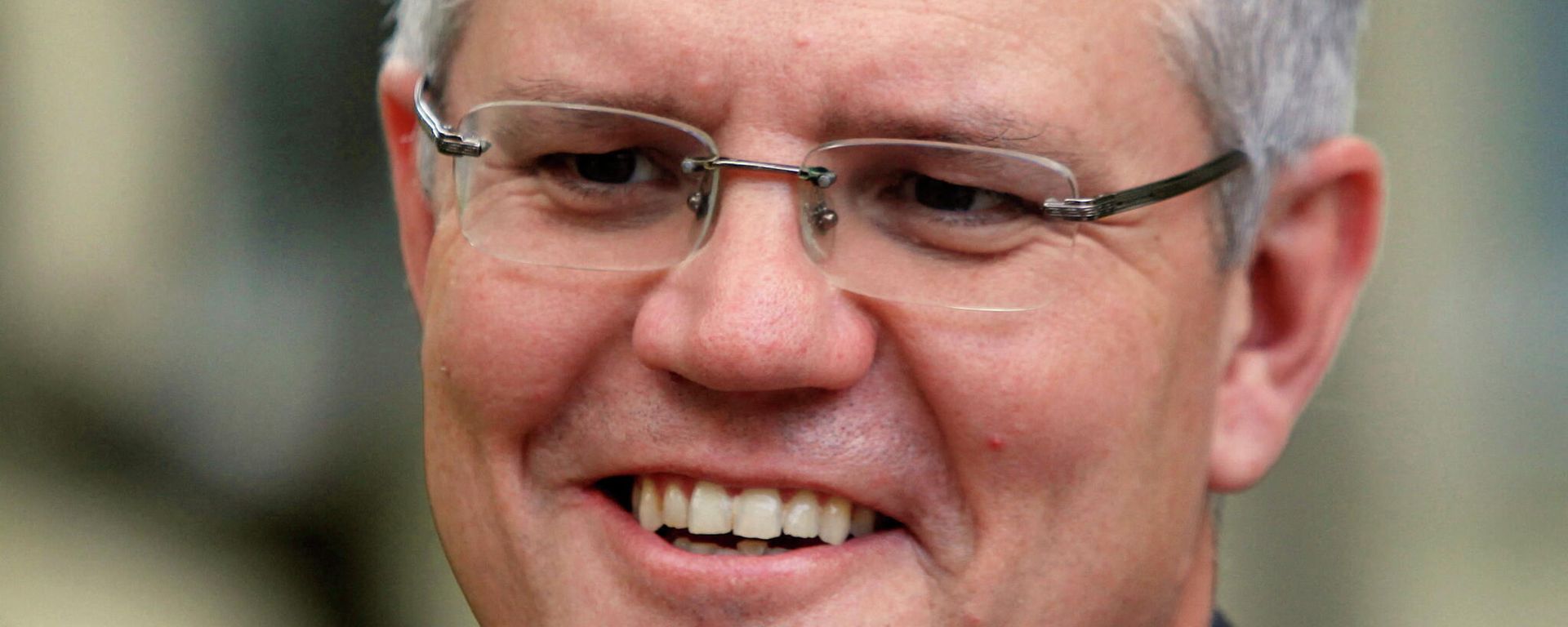 Australia's Immigration Minister Scott Morrison smiles during an interview with Reuters in Phnom Penh September 26, 2014. Cambodia has agreed to resettle potentially hundreds of refugees intercepted while trying to reach Australia in exchange for an extra A$40 million ($35 million) in aid, Australia's immigration minister said on Friday. Australia's Immigration Minister Scott Morrison smiles during an interview with Reuters in Phnom Penh September 26, 2014. Cambodia has agreed to resettle potentially hundreds of refugees intercepted while trying to reach Australia in exchange for an extra A$40 million ($35 million) in aid, Australia's immigration minister said on Friday. - Sputnik International, 1920, 04.02.2022