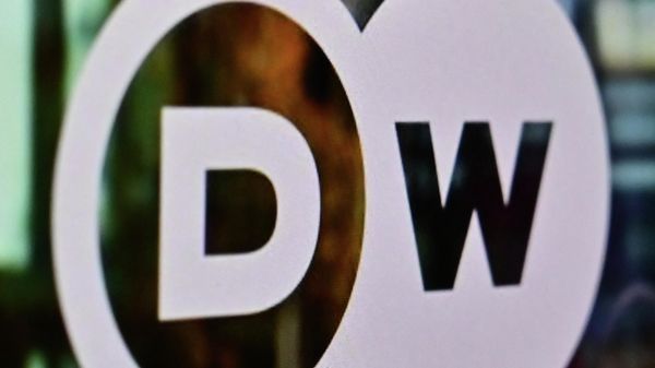 A photograph taken on February 3, 2022, shows the logo of German broadcaster Deutsche Welle displayed on a computer screen in Moscow. - Sputnik International