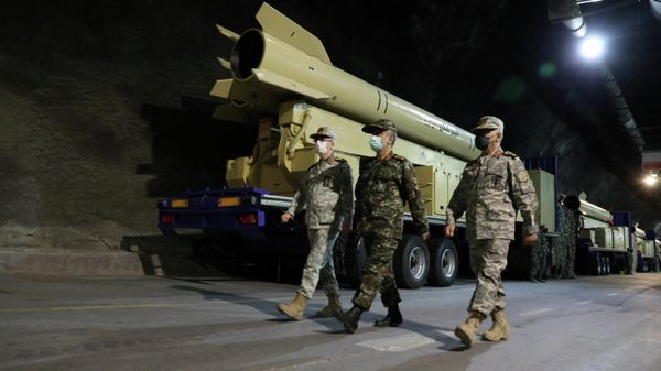 Iranian Armed Forces Chief of Staff Major General Mohammad Bagheri and IRGC Aerospace Force Commander Amir Ali Hajizadeh walk during the unveiling of Kheibarshekan missile at an undisclosed location in Iran, in this picture obtained on February 9, 2022 - Sputnik International
