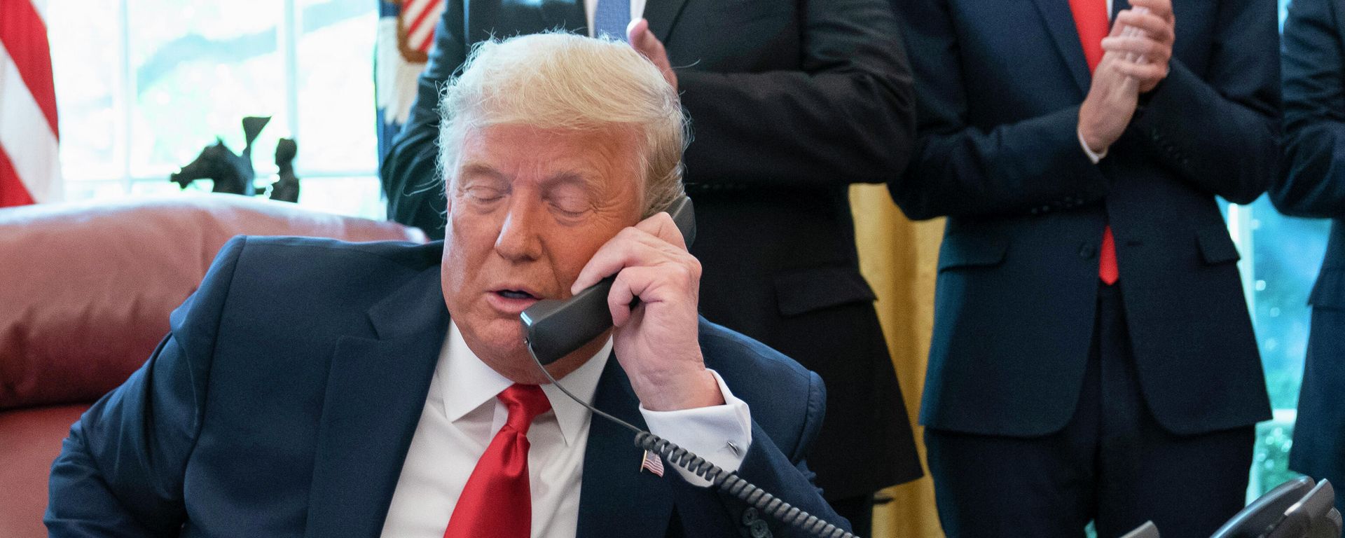  In this Oct. 23, 2020, photo, President Donald Trump talks on a phone during a call with the leaders of Sudan and Israel in the Oval Office of the White House, in Washington.  - Sputnik International, 1920, 24.01.2025