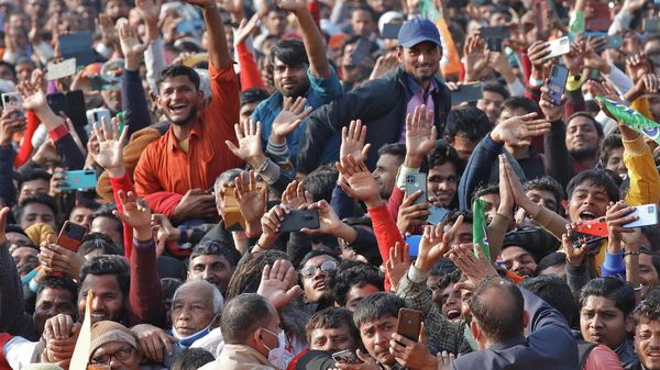 Supporters of India's ruling Bharatiya Janata Party (BJP) cheer as they listen to Yogi Adityanath, Chief Minister of the northern state of Uttar Pradesh, during an election campaign rally in Bijnor district of the northern state, India, February 10, 2022. - Sputnik International