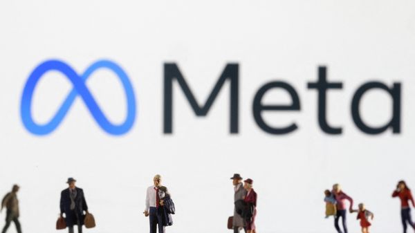 Small figurines are seen in front of displayed Meta logo - Sputnik International