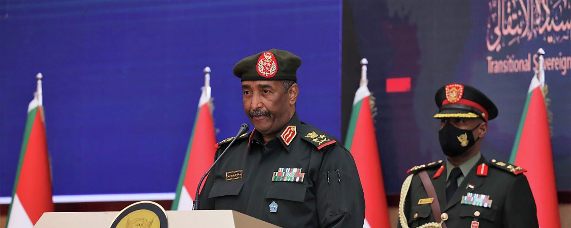 In this photo provided by the Sudan Transitional Sovereign Council, Sudan's top general Abdel Fattah Al-Burhan, center, speaks during a ceremony to reinstate Prime Minister Abdalla Hamdok, who was deposed in a coup last month, in Khartoum, Sudan, Sunday Nov. 21, 2021. Burhan, said in televised statements that Hamdok will lead an independent technocratic cabinet until elections can be held. It would still remain under military oversight. In this photo provided by the Sudan Transitional Sovereign Council, Sudan's top general Abdel Fattah Al-Burhan, center, speaks during a ceremony to reinstate Prime Minister Abdalla Hamdok, who was deposed in a coup last month, in Khartoum, Sudan, Sunday Nov. 21, 2021. Burhan, said in televised statements that Hamdok will lead an independent technocratic cabinet until elections can be held. It would still remain under military oversight. - Sputnik International, 1920, 23.09.2022