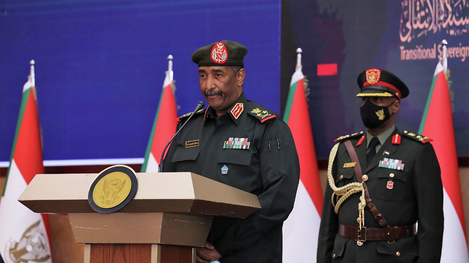 In this photo provided by the Sudan Transitional Sovereign Council, Sudan's top general Abdel Fattah Al-Burhan, center, speaks during a ceremony to reinstate Prime Minister Abdalla Hamdok, who was deposed in a coup last month, in Khartoum, Sudan, Sunday Nov. 21, 2021. Burhan, said in televised statements that Hamdok will lead an independent technocratic cabinet until elections can be held. It would still remain under military oversight. In this photo provided by the Sudan Transitional Sovereign Council, Sudan's top general Abdel Fattah Al-Burhan, center, speaks during a ceremony to reinstate Prime Minister Abdalla Hamdok, who was deposed in a coup last month, in Khartoum, Sudan, Sunday Nov. 21, 2021. Burhan, said in televised statements that Hamdok will lead an independent technocratic cabinet until elections can be held. It would still remain under military oversight. - Sputnik International, 1920, 14.02.2022