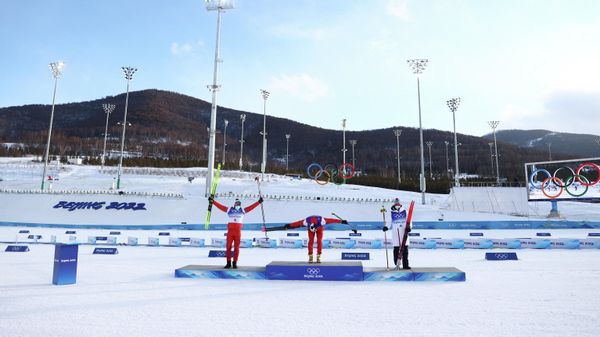 Silver medallist Ivan Yakimushkin of the Russian Olympic Committee, gold medallist Alexander Bolshunov of the Russian Olympic Committee and bronze medallist Simen Hegstad Krueger of Norway celebrate on the podium.  - Sputnik International