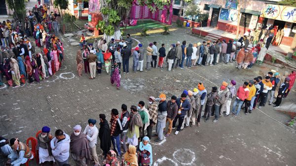 Indian voters wait in line to cast their ballots at a polling station near the India-Pakistan border for the Punjab State Assembly elections in the village of Bachiwind, some 40 kilometers (25 miles) from Amritsar, Sunday, Feb. 20, 2022. Indian voters wait in line to cast their ballots at a polling station near the India-Pakistan border for the Punjab State Assembly elections in the village of Bachiwind, some 40 kilometers (25 miles) from Amritsar, Sunday, Feb. 20, 2022. - Sputnik International