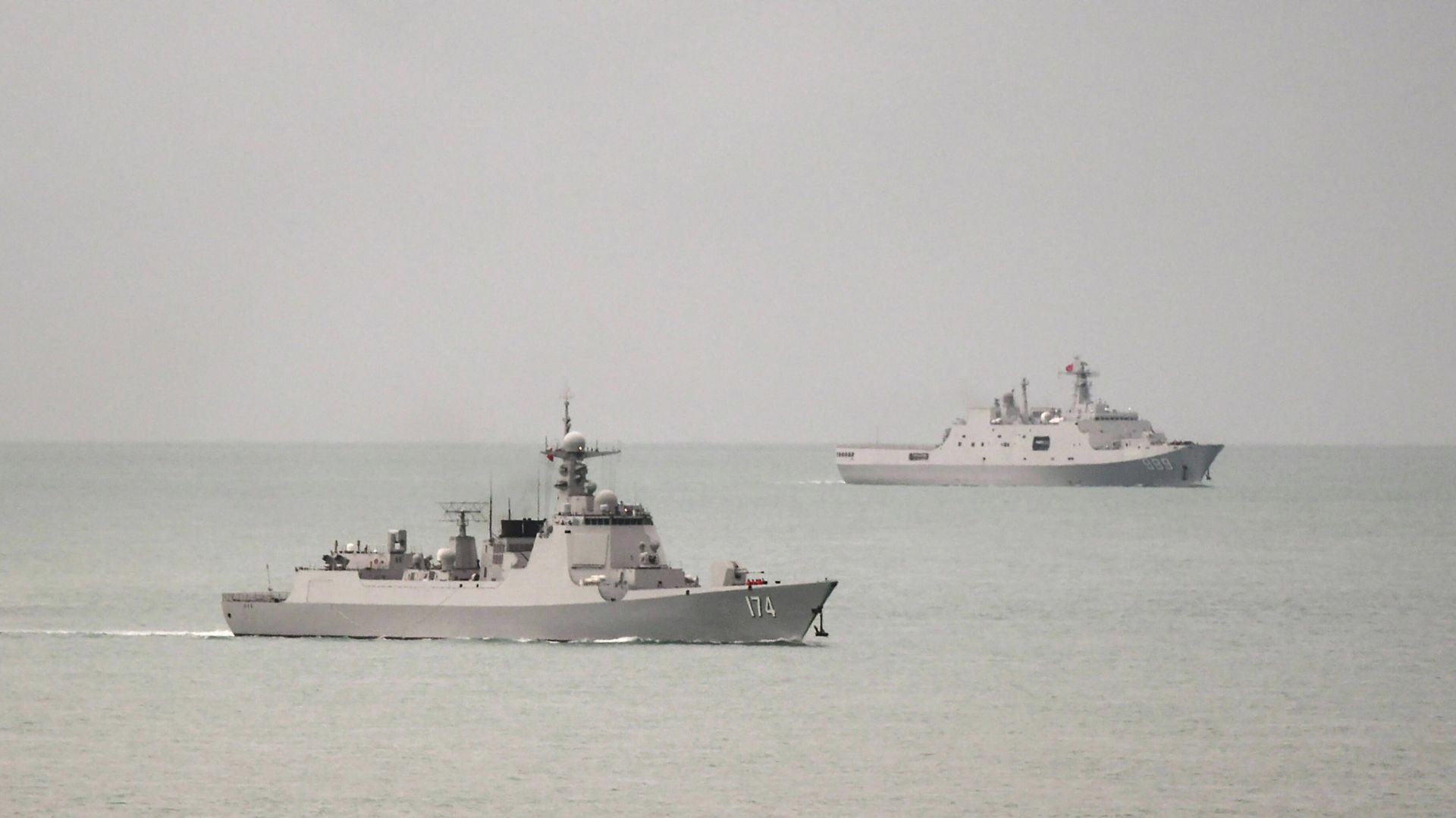 A handout photo taken on February 18, 2022 and received on February 20, 2022 shows a Chinese PLA-N Luyang-class guided missile destroyer (L) and a PLA-N Yuzhao-class amphibious transport dock vessel (R) leaving the Torres Strait and entering the Coral Sea after the Australian Defence Force confirm that on 17 February 2022, a Royal Australian Air Force (RAAF) P-8A Poseidon detected a laser illuminating the aircraft from a People’s Liberation Army – Navy (PLA-N) vessel A handout photo taken on February 18, 2022 and received on February 20, 2022 shows a Chinese PLA-N Luyang-class guided missile destroyer (L) and a PLA-N Yuzhao-class amphibious transport dock vessel (R) leaving the Torres Strait and entering the Coral Sea after the Australian Defence Force confirm that on 17 February 2022, a Royal Australian Air Force (RAAF) P-8A Poseidon detected a laser illuminating the aircraft from a People’s Liberation Army – Navy (PLA-N) vessel - Sputnik International, 1920, 21.02.2022