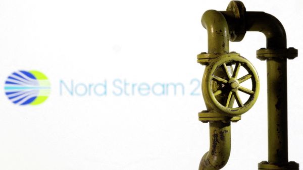 A 3D printed natural gas pipeline is placed in front of displayed Nord Stream 2 logo in this illustration taken, February 8, 2022 - Sputnik International